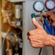 HVAC technician with thumbs up